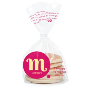 Plastic bag with pancakes, red circle "M", Marcel's brand, labeled "6 Happy Pancakes".