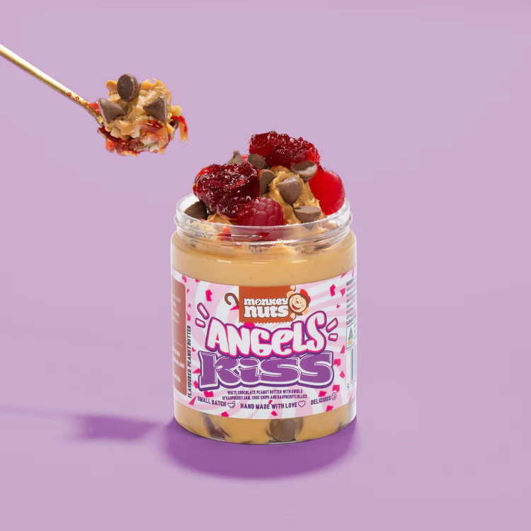 Jar of Monkey Nuts Angels Kiss white chocolate peanut butter with chocolate chips, jelly, and raspberries.