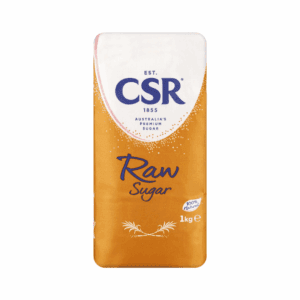 1kg package of CSR raw sugar, orange with blue accents, labeled 100% natural.