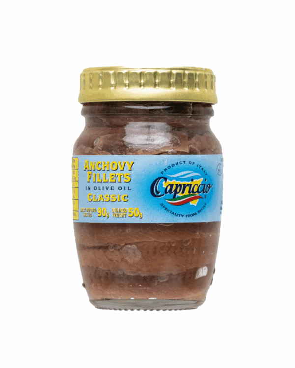 CAPRICCIO ANCHOVY FILLETS WITH OLIVE OIL Glass jar of Italian anchovy fillets in olive oil with a yellow lid and blue label.