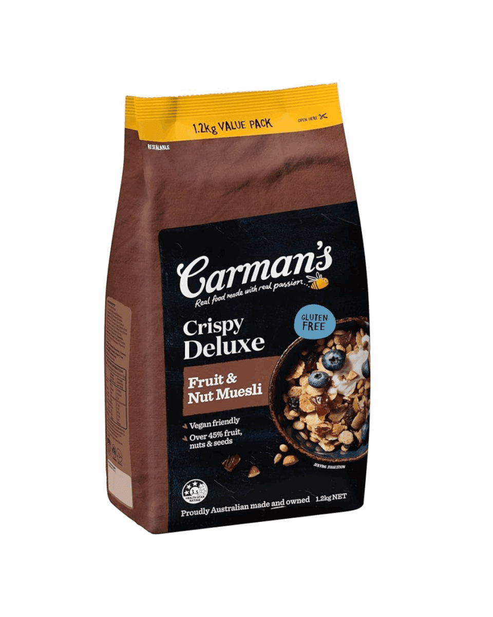 Carman's Deluxe Gluten Free Muesli bag, brown, 1.12 kg, with nuts and berries depiction.