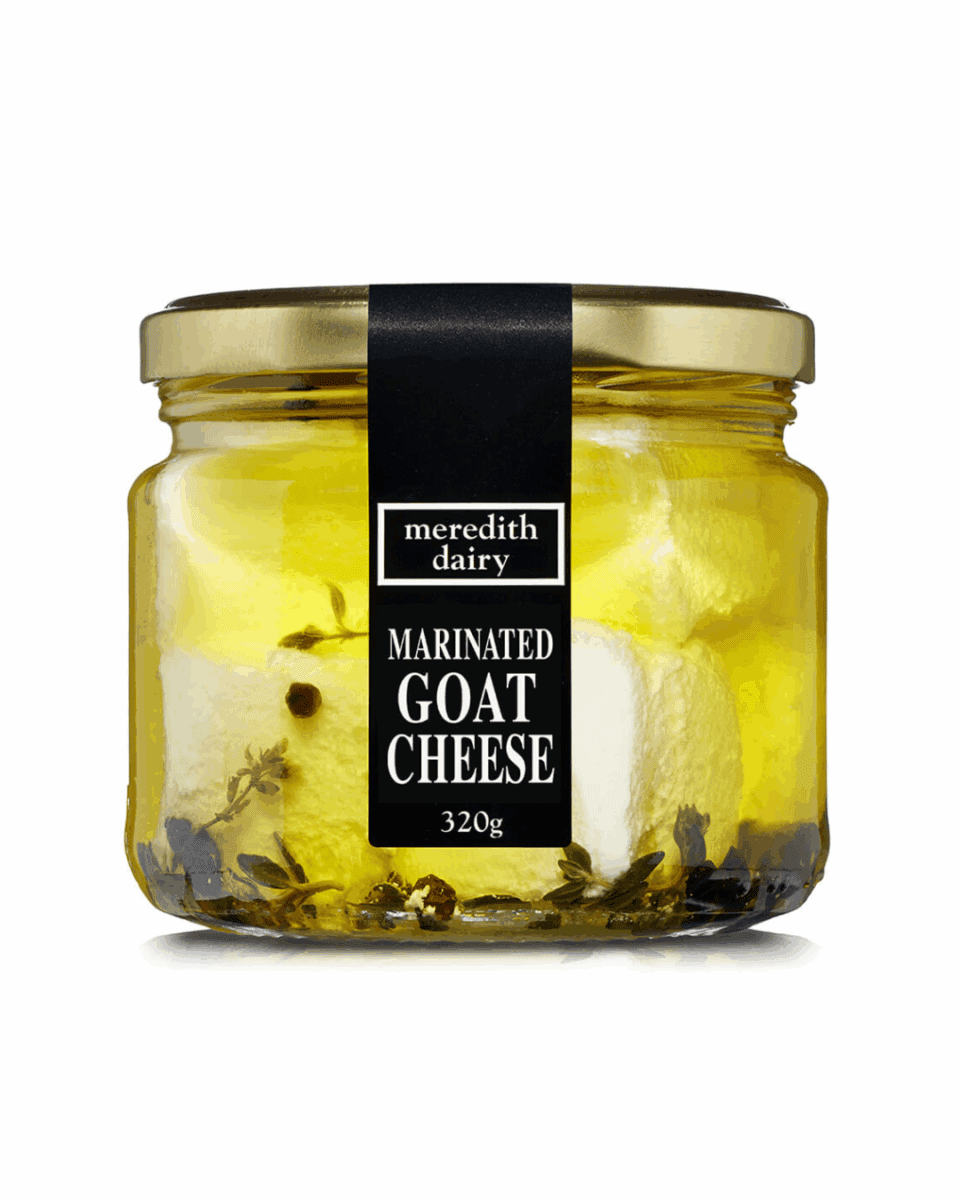 Jar of 320g goat cheese marinated in olive oil with garlic, thyme, and peppercorns.