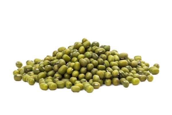 Mung Beans on White Background Pile of green mung beans on a white background.