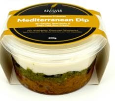 Plastic container of "Mediterranean Dip" with three-layered dip, partially in cardboard sleeve.