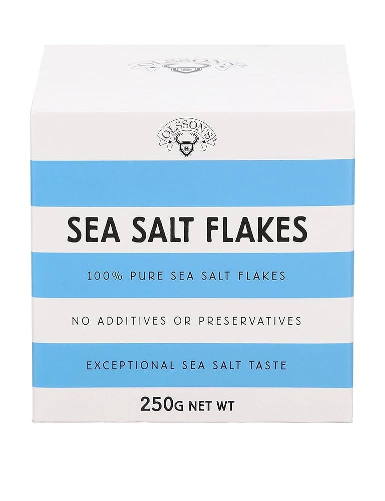 White and blue box of Olsson's Sea Salt Flakes, 250g, pure with no additives or preservatives.