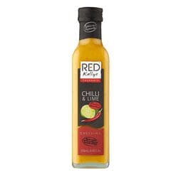 Red Kellys Tasmania Chilli & Lime dressing in a tall glass bottle with chili and lime on label.