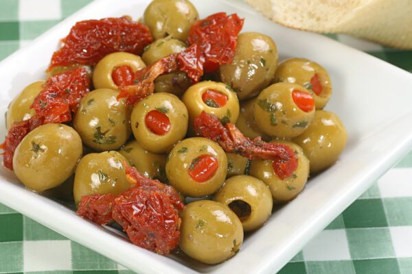 Dish,Of,Pimento,Stuffed,Green,Olives,With,Sun,Dried,Tomatoes