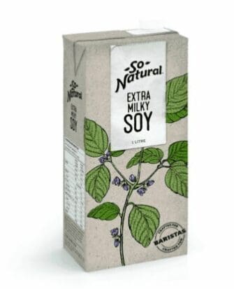 Carton of So Natural Extra Milky Soy beverage, 1 liter, with green leaves and soybeans.