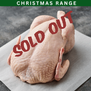 Raw whole chicken on parchment paper with Christmas Range label and sold out text overlay