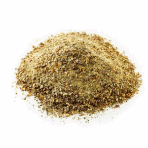 Ground spice blend mound, brown and yellow, dry, granular texture for cooking or flavoring.