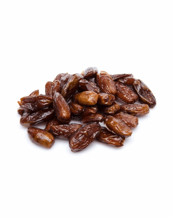 Glossy brown dates piled on a white background, shiny and whole.