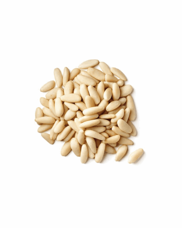 AEGEAN PINENUTS Pile of smooth, pale cream pine nuts on a white background.