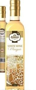 Bottle of Aegean white wine vinegar, golden cap, grapevine label, partial bottle in background.