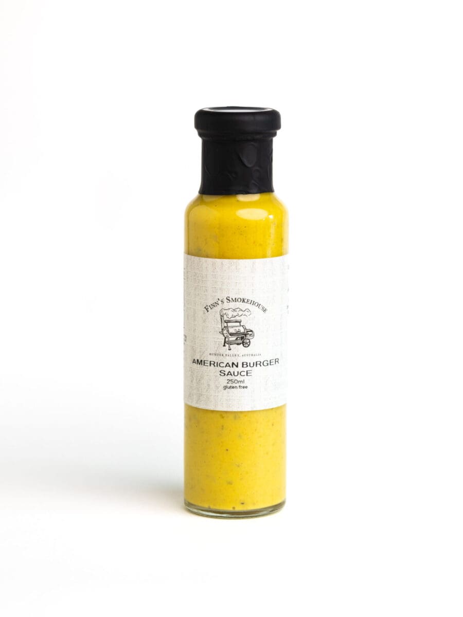 Clear bottle with black cap, yellow sauce labeled "American Burger Sauce," 250ml, gluten-free.