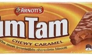 Rectangular pack of Arnott's Tim Tam biscuits, Chewy Caramel flavor, caramel background.