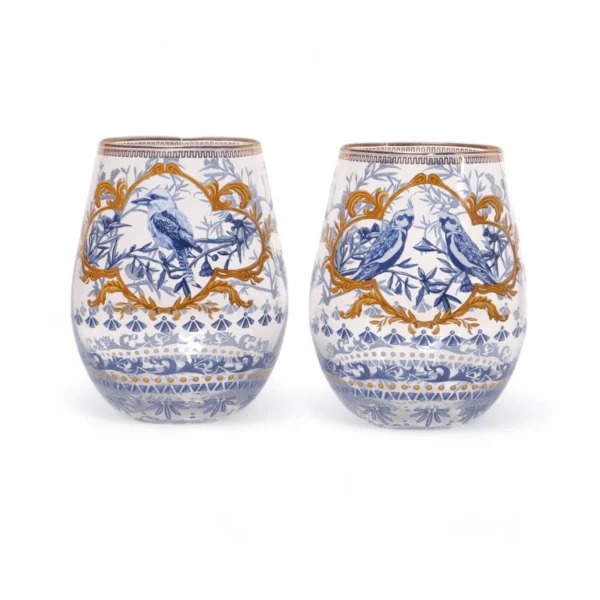 Two glass tumblers with intricate blue and gold bird and floral designs on a white background.