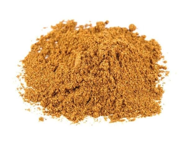 Brown, finely ground spice on white background for cooking or seasoning.