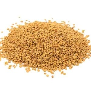 Pile of small, brownish-yellow seeds on a white background.