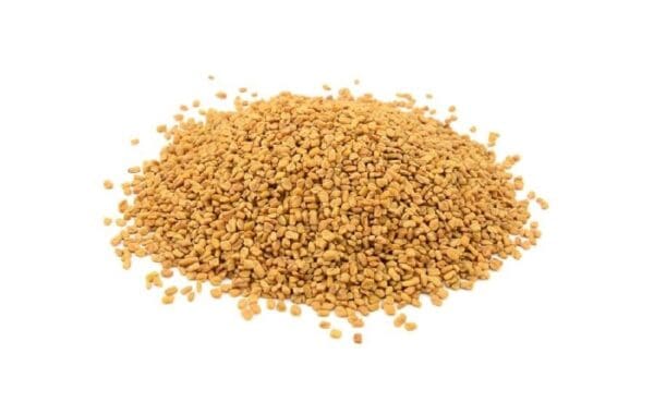 Pile of small, brownish-yellow seeds on a white background.