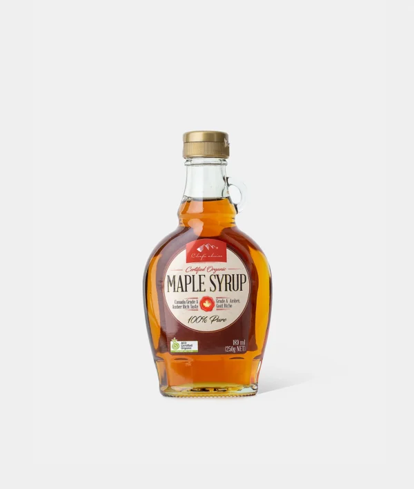 Canadian Organic Grade A Amber Maple Syrup Bottle Organic Grade A Amber maple syrup bottle, gold cap, 189 ml, from Canada, plain background.