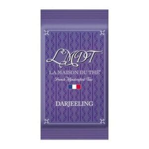 Purple packet labeled "LMDT, La Maison du Thé," with Darjeeling tea design and French flag.