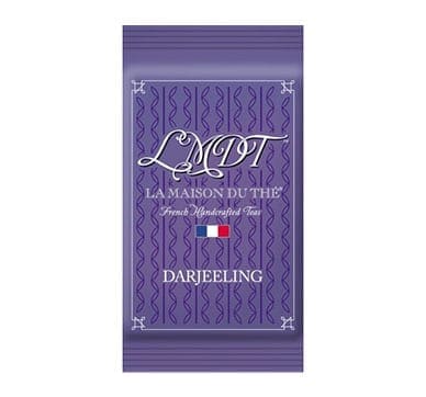 Purple packet labeled "LMDT, La Maison du Thé," with Darjeeling tea design and French flag.