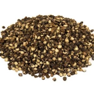 Dried cracked black peppercorns in various shades on a plain white background.