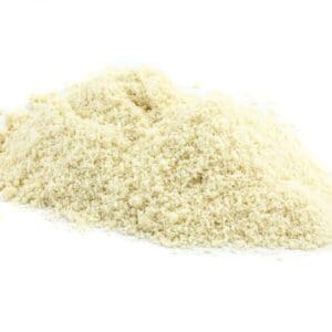 Pile of finely ground light-colored breadcrumbs on a plain white background.