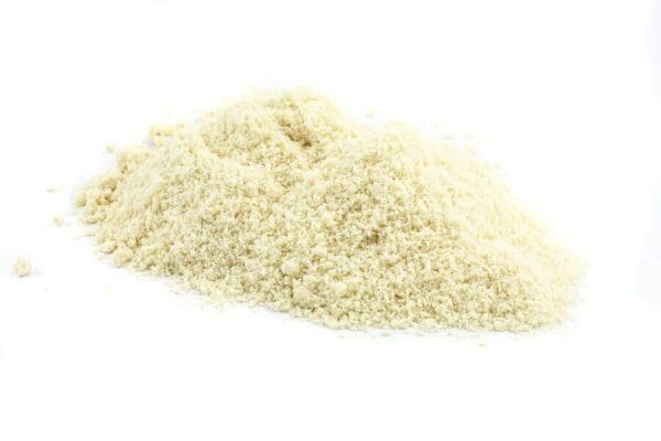 Breadcrumb Pile on White Background Pile of finely ground light-colored breadcrumbs on a plain white background.