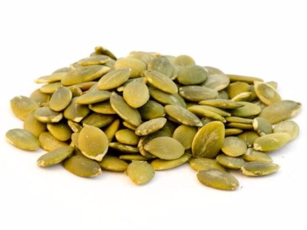 Green Pumpkin Seeds Close-Up Close-up of green pumpkin seeds (pepitas) on a white background, flat and glossy.