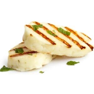 Grilled halloumi slices with herbs on white background.