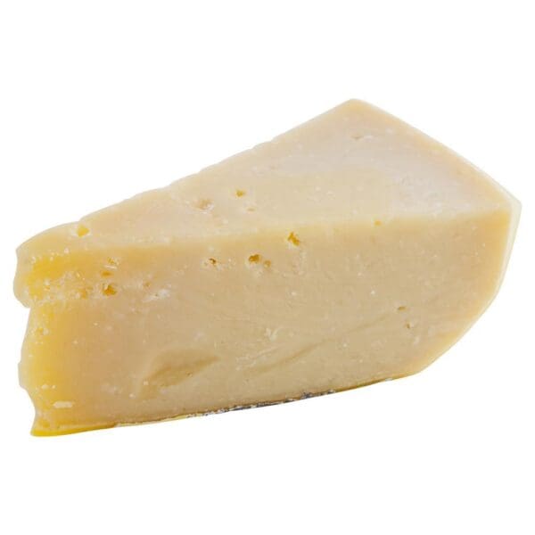 Hard Cheese Wedge with Crystals Hard cheese wedge, pale yellow, compact texture, small holes and surface crystals.
