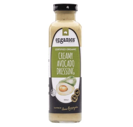 Bottle of Ozganics organic creamy avocado dressing, 350ml, with black cap and avocado images.
