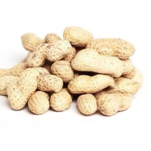 Pile of unshelled peanuts with textured beige shells on a white background.