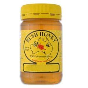 Jar of Bush Honey, yellow lid, label with Australia outline, bees, 500g, "Raw Australian Honey."