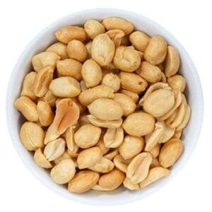 Bowl of shelled, roasted peanuts on a white background.