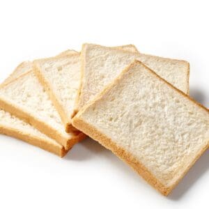 Five white bread slices fanned out on a white background.