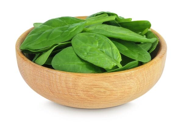 LETTUCE SPINACH BABY PRE-PACK Wooden bowl with fresh, crisp green spinach leaves.