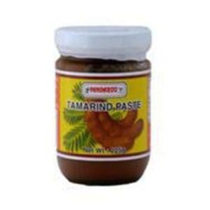 Jar of tamarind paste with white lid, yellow label, and tamarind pods illustration.