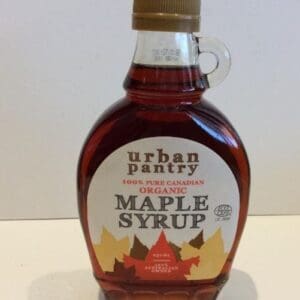 Urban Pantry organic maple syrup bottle, labeled 100% pure Canadian, with round shape and handle.