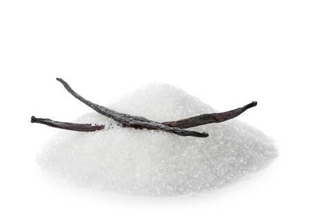 Pile of white sugar with two dark brown vanilla beans on plain white background.
